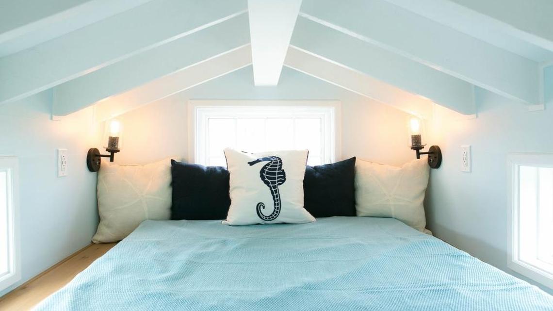 The bedroom is tucked under the eaves in the Shonsie model of tiny house by 84 Lumber. Tours of the tiny house will be given Thursday at the 84 Lumber store on U.S. 49 in Gulfport.