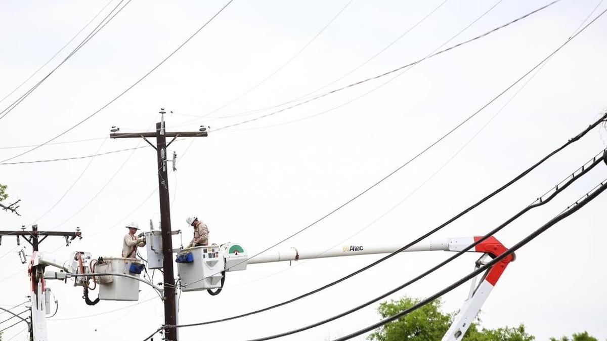 Mississippi Power crews work to repair lines near the corner of DeBuys Road and Pass Road in April 2017. The state Public Service Commission is investigating whether customers of Mississippi Power and other utility companies may be able to get a rate reduction thanks to the new federal tax bill passed in December.