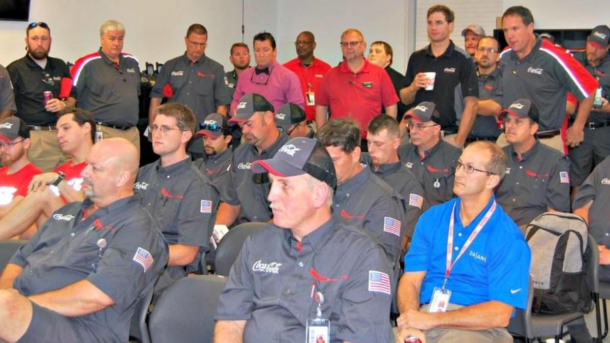 Staff members gather for the official announcement Monday that Coca-Cola Bottling Co. United has acquired the Ocean Springs sales and distribution territory along with nine others.