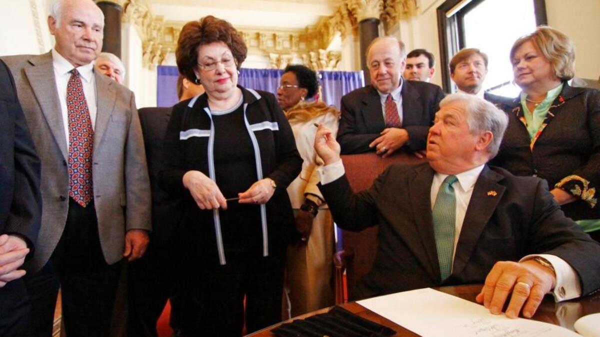 Then-Gov. Haley Barbour offers Coast lawmakers a signature pen after signing the casino incentive bill in 2009. The tax incentives encouraged casino developers to build golf courses, hotels, convention facilities and other non-gambling attractions, giving the developers a 30 percent sales-tax rebate for tourism projects. Barbour now is lobbying for casinos in Georgia.