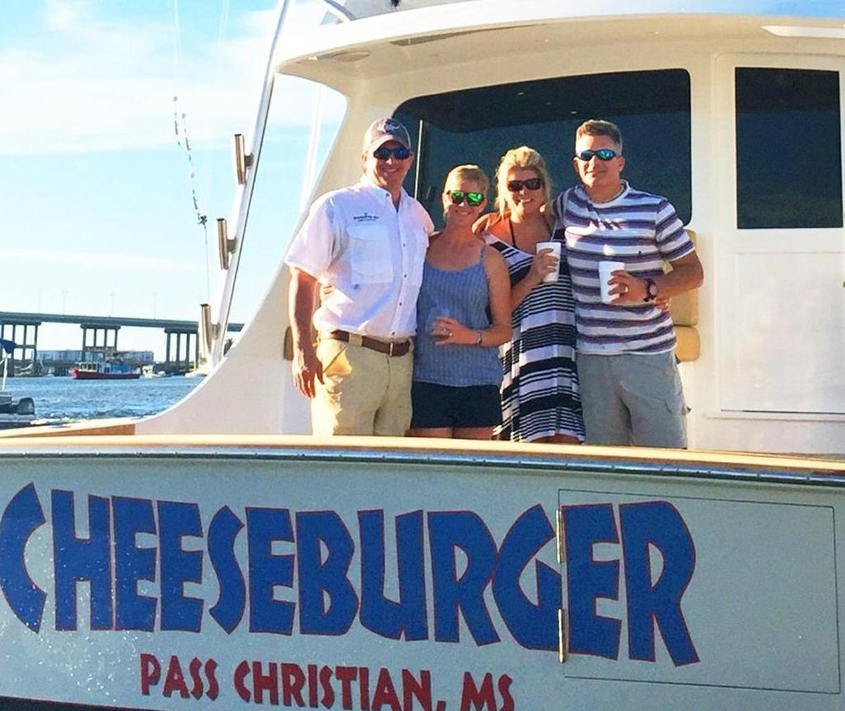 Shaggy’s owners Rimmer Covington and Ron Ladner with their wives, Taylor and Laura, on board the Cheeseburger fishing boat.