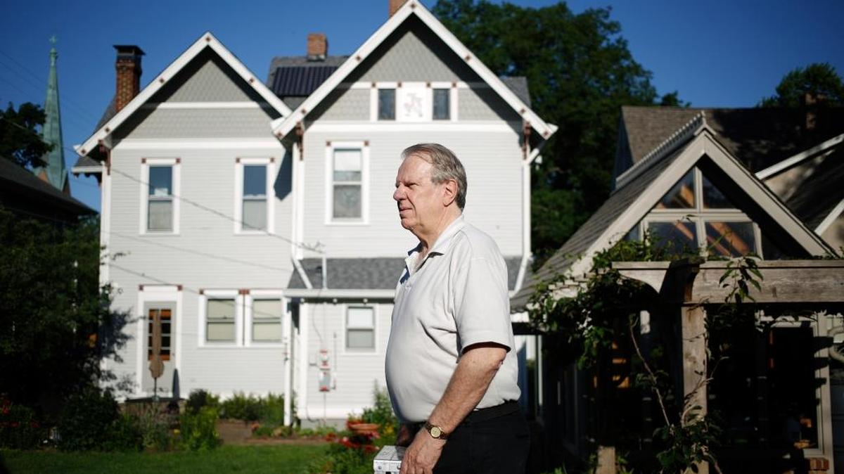Mike Mullett behind his house, which features roof-mounted solar panels, in Columbus, Ind., May 30, 2017. A decline in rooftop solar panel installations has coincided with a concerted and well-funded lobbying campaign by traditional utilities, which have been working in state capitals across the country to reverse incentives for homeowners to install solar panels.