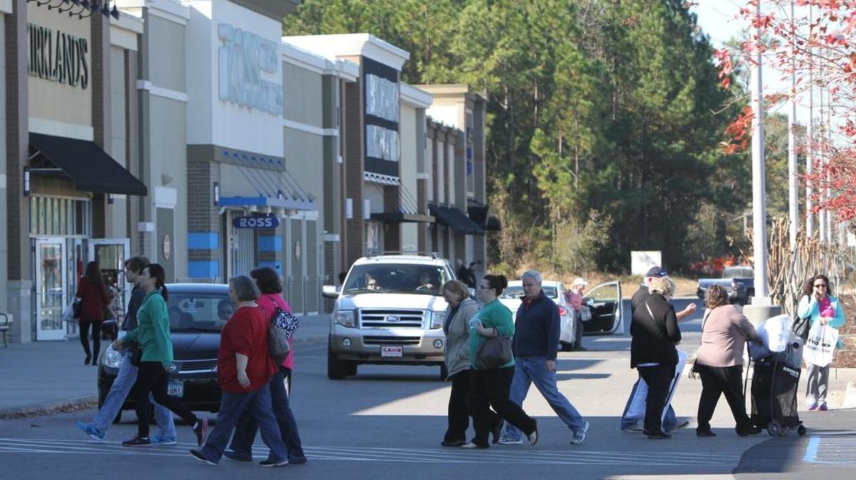 Shoppers come and go at The Promenade shopping center in D’Iberville in 2014. The stores at area malls, shopping centers and outlets will be busy July 26-27 for the annual Sales Tax Holiday.