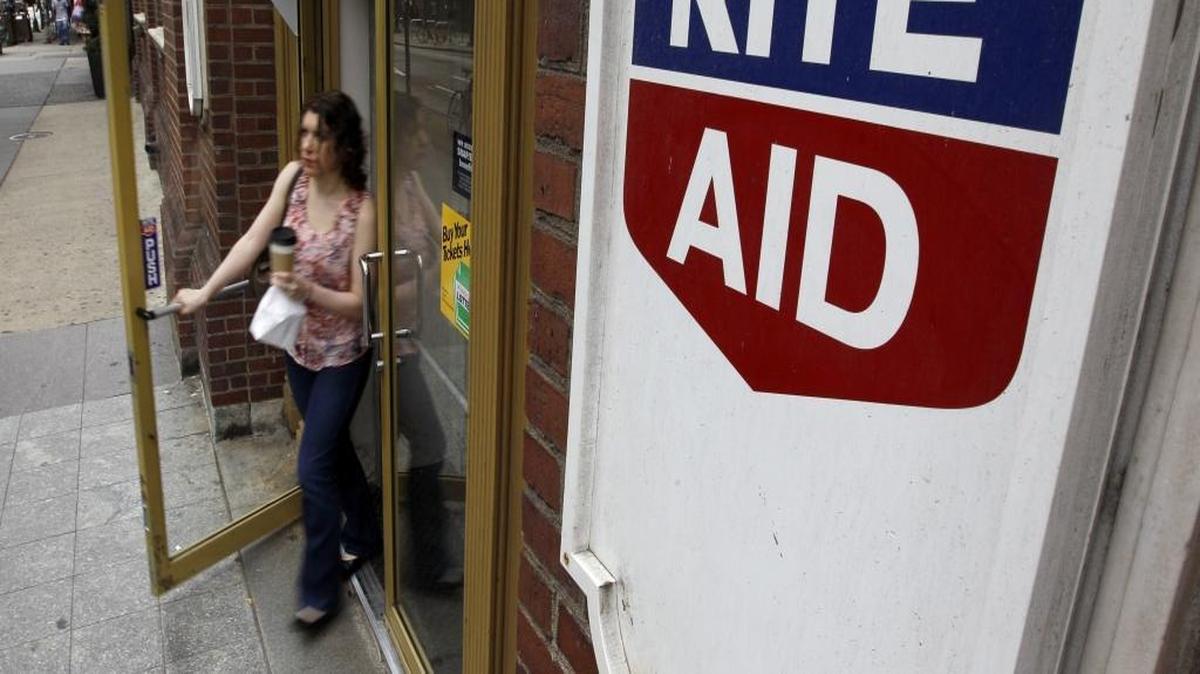 FILE- In this June 20, 2011, file photo, a woman exits a Rite Aid store, in Philadelphia. The Rite Aid in Picayune is closing. Its pharmacy records will be transferred to one of two local Walgreens.