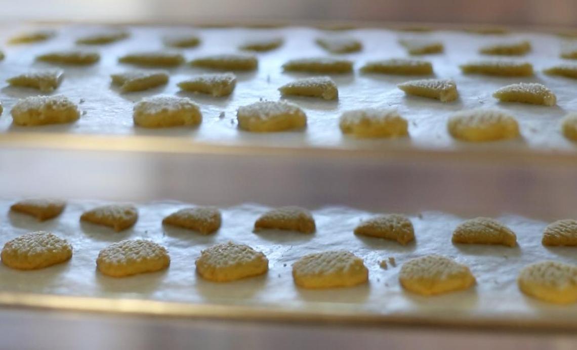 Baked cookies wait to be bagged on Tuesday, Nov. 22, 2016 at The Cat Island Cookie & Cracker Company in Pass Christian. The company recently closed.