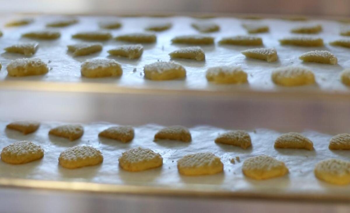 Baked cookies wait to be bagged on Tuesday, Nov. 22, 2016 at The Cat Island Cookie & Cracker Company in Pass Christian. The company recently closed.