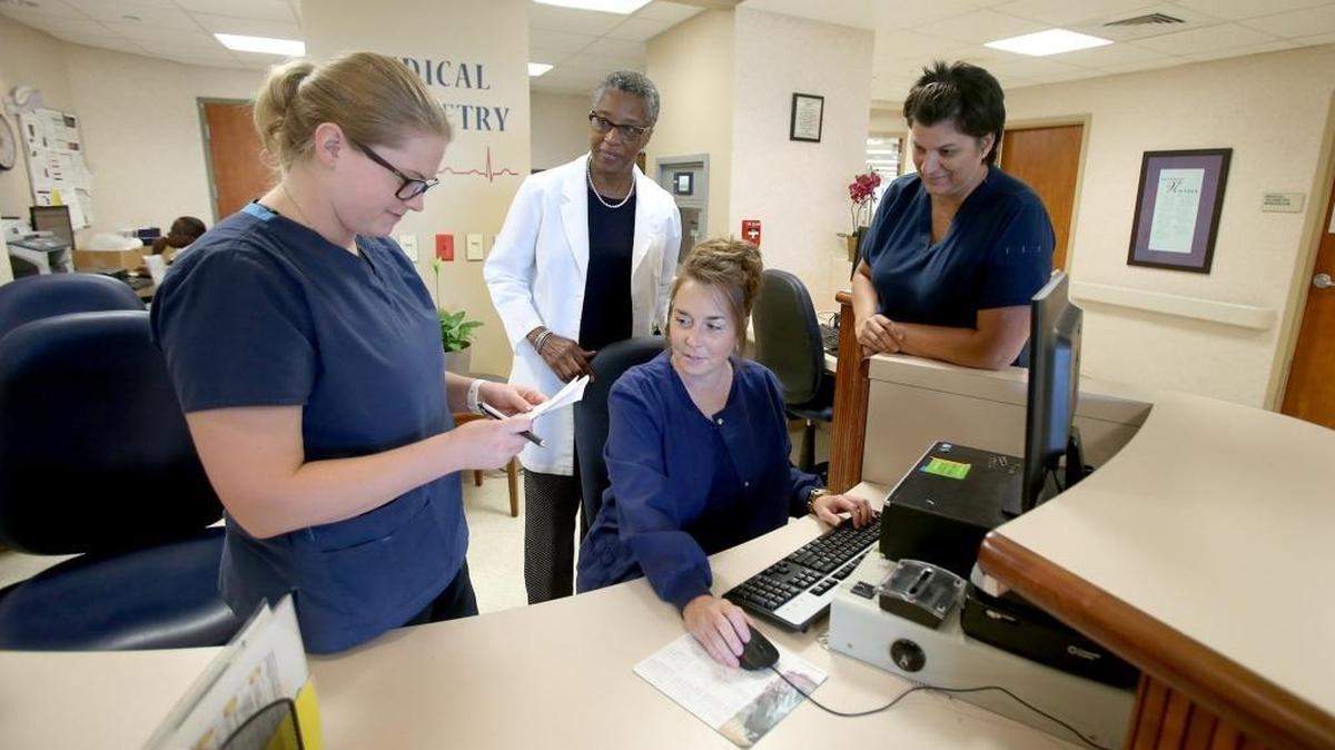 Tessa Williamson, Cheryl Thompson, Rhonda Cooksey and Denise Quick gather at nurse's station at Garden Park Medical Center in Gulfport, Thursday, June 8, 2017. The Gulfport hospital recently received an A rating.