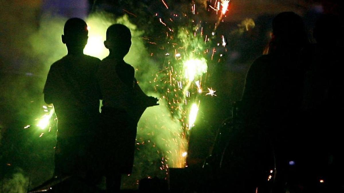 Children play with sparklers on the beach in Gulfport. This year the fireworks shows in three cities will go on with social distancing recommended to help prevent the spread of coronavirus.