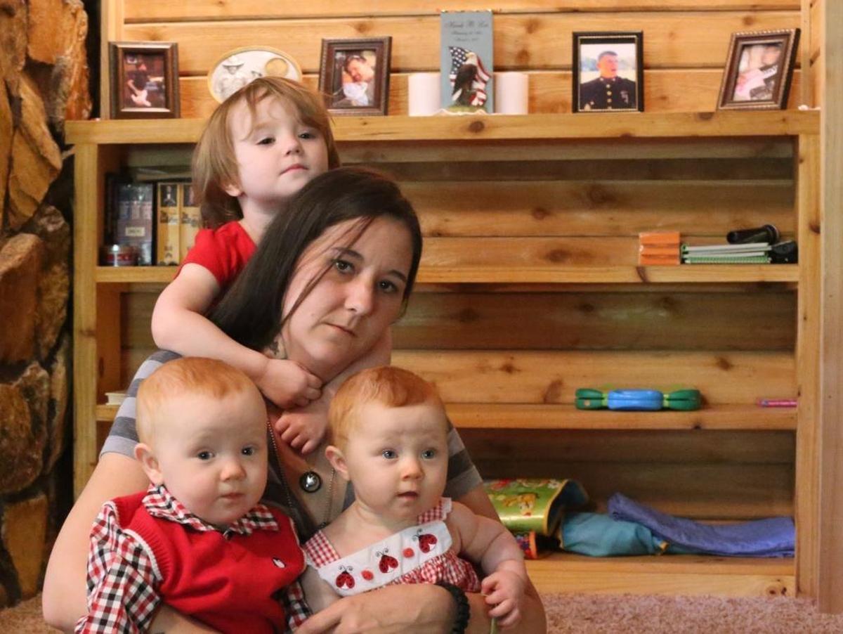 Jamie Lee of Saucier, with her daughter, Alana, 2, and twin 9-month-olds, Hunter and Hailey, is struggling to get Veterans Affairs benefits after her husband, Hank Lee, a Marine veteran, died in March. The cause of death of Hank Lee, who was being treated for post traumatic stress disorder and traumatic brain injury, is still unknown. Photographer’s comment: Many things in life are not fair, and things happen that shouldn’t. This is one of those stories, and the look on the mother’s face, surrounded by her young children, captures her sad situation.