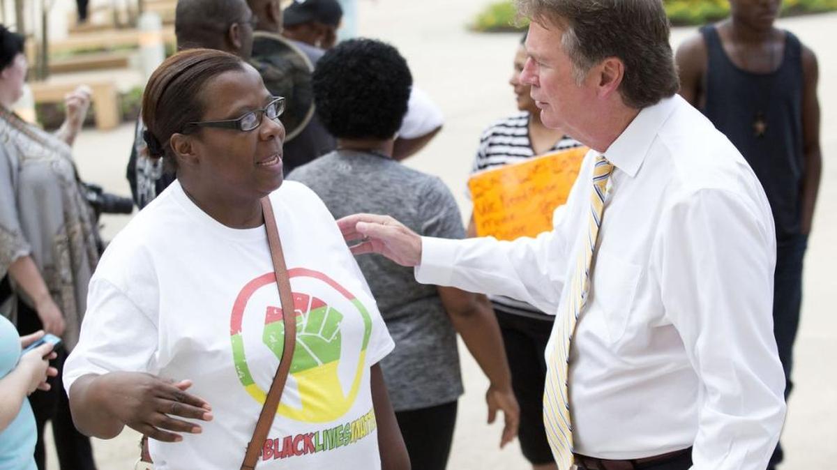 Covington Mayor Mike cooper, right, and Covington resident Retta Alexander talk during a Black Lives Matter rally at the St. Tammany Parish Justice Center in Covington.