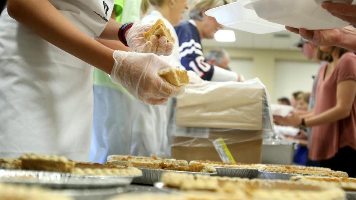 Hundreds of volunteers gather at the Lyman Community Center in Gulfport to assemble meals for Thanksgiving in 2016. The Gulf Coast Public Safety Feed the Needy program is in its 28th year.
