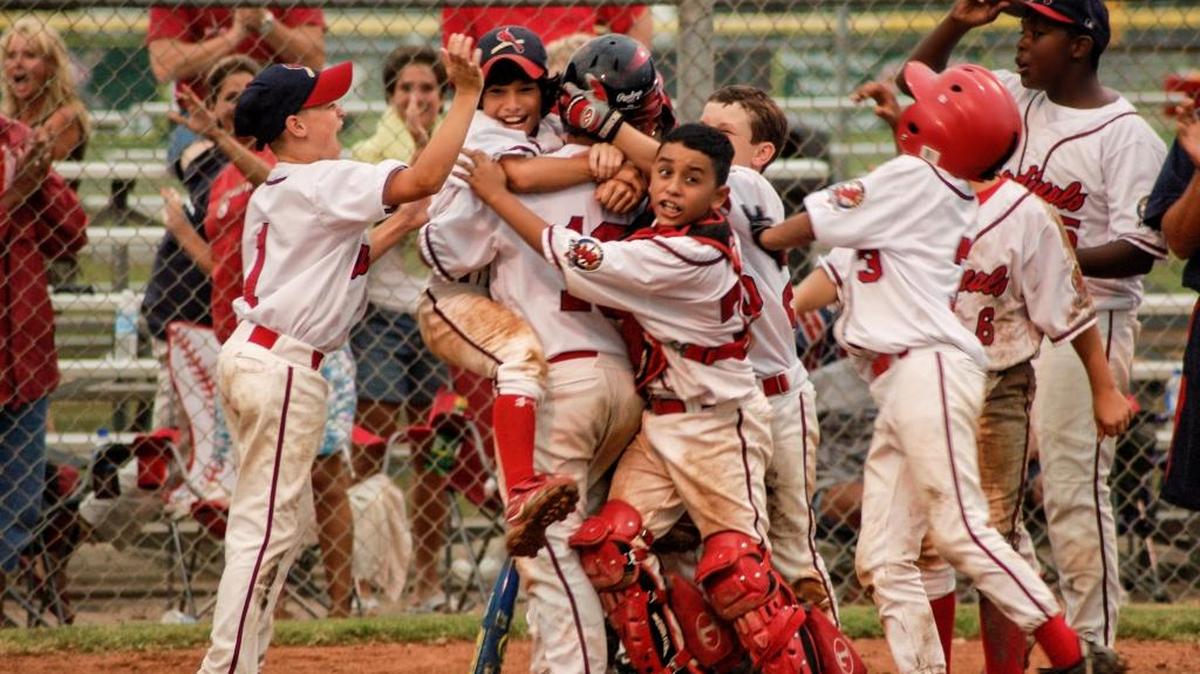 All athletes relish the elation of achieving victory in a big game, performing at their best and being part of a championship team. The Gulf Coast Cardinals celebrate a victory, Lake Jackson, Texas, 2009.