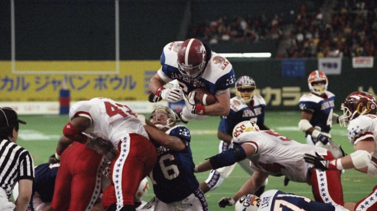 Kevin Turner, of Alabama, dives over the top for a touchdown in the fourth quarter of the Japan Bowl, the American collegiate all-star football game, at the Tokyo Dome. A fullback at Alabama before playing eight years in the NFL for New England and Philadelphia, Turner was 46 when he died in 2016. He had been diagnosed with amyotrophic lateral sclerosis, known as ALS or Lou Gehrig's disease, but after studying his brain researchers declared that it was actually CTE.