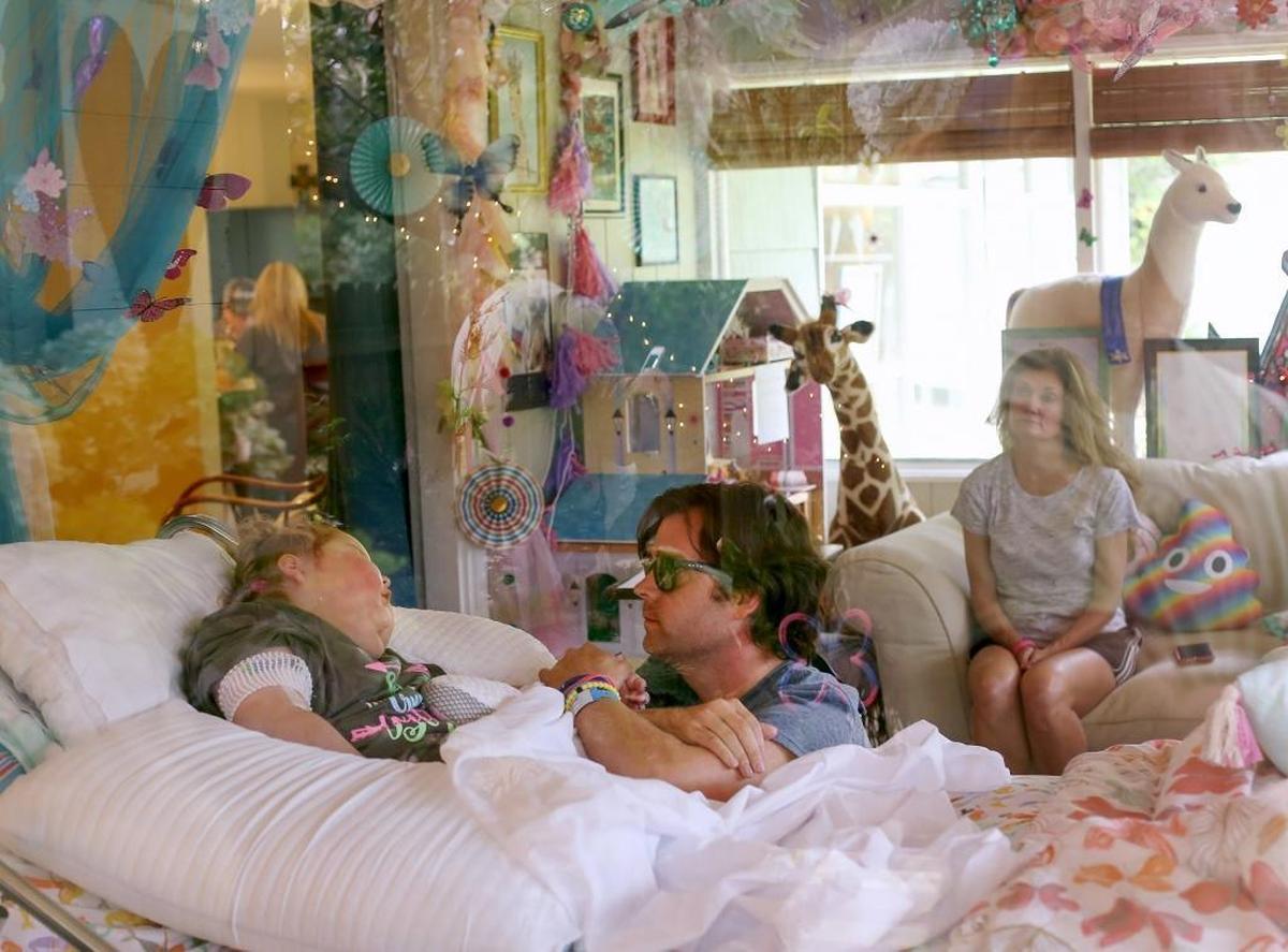 Josh Myers holds his daughter Sophia Myers’ hand in the sunroom that was converted into a beautiful bedroom for her arrival home from the hospital on Monday, Sept. 18, 2017. Sophia was hospitalized three weeks prior in the pediatric intensive care unit at USA Children’s & Women’s Hospital in Mobile. She was suffering from a rare, terminal brain tumor called diffuse intrinsic potine glioma. Photographer’s comments: The connection between Josh Myers and his daughter makes this photograph extremely touching and poignant. That combined with the composition and reflection of lights makes it one of my favorites.