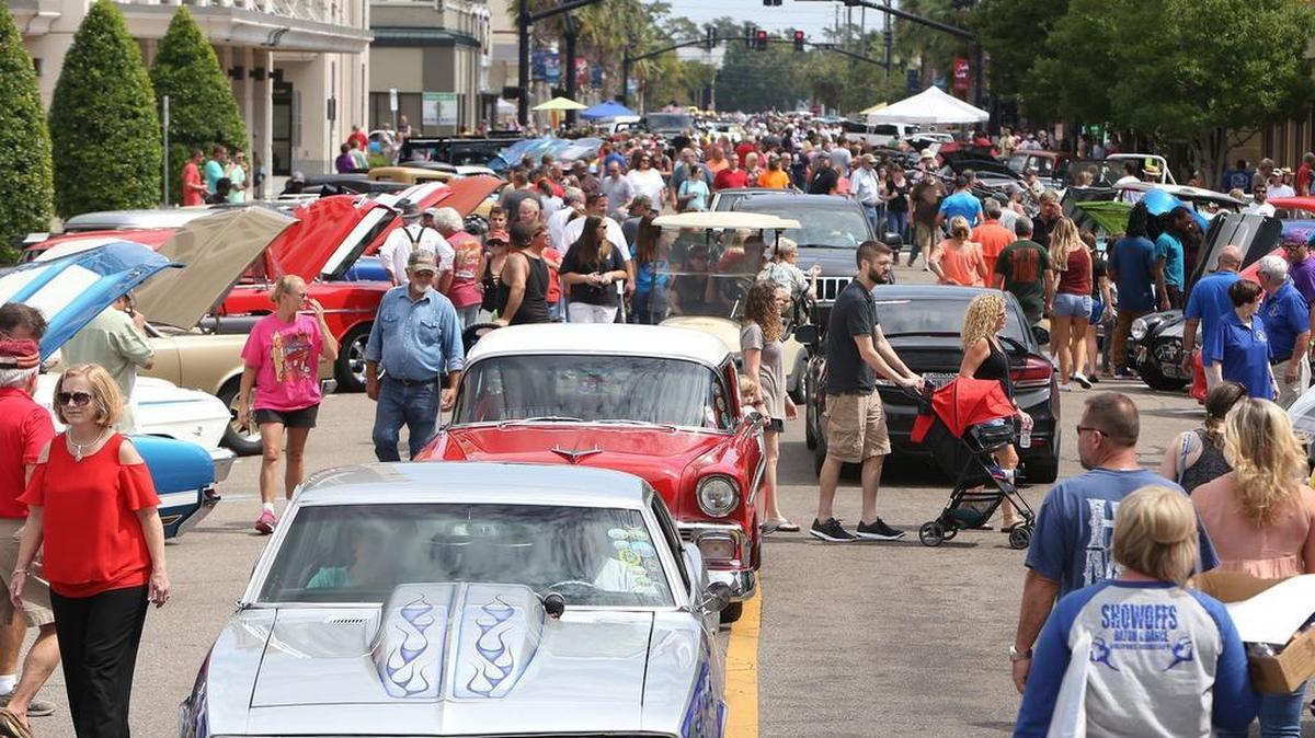 Visitors and classic cars fill downtown Gulfport during their View The Cruise on the first day of Cruisin' The Coast on Sunday, Oct. 2, 2016.