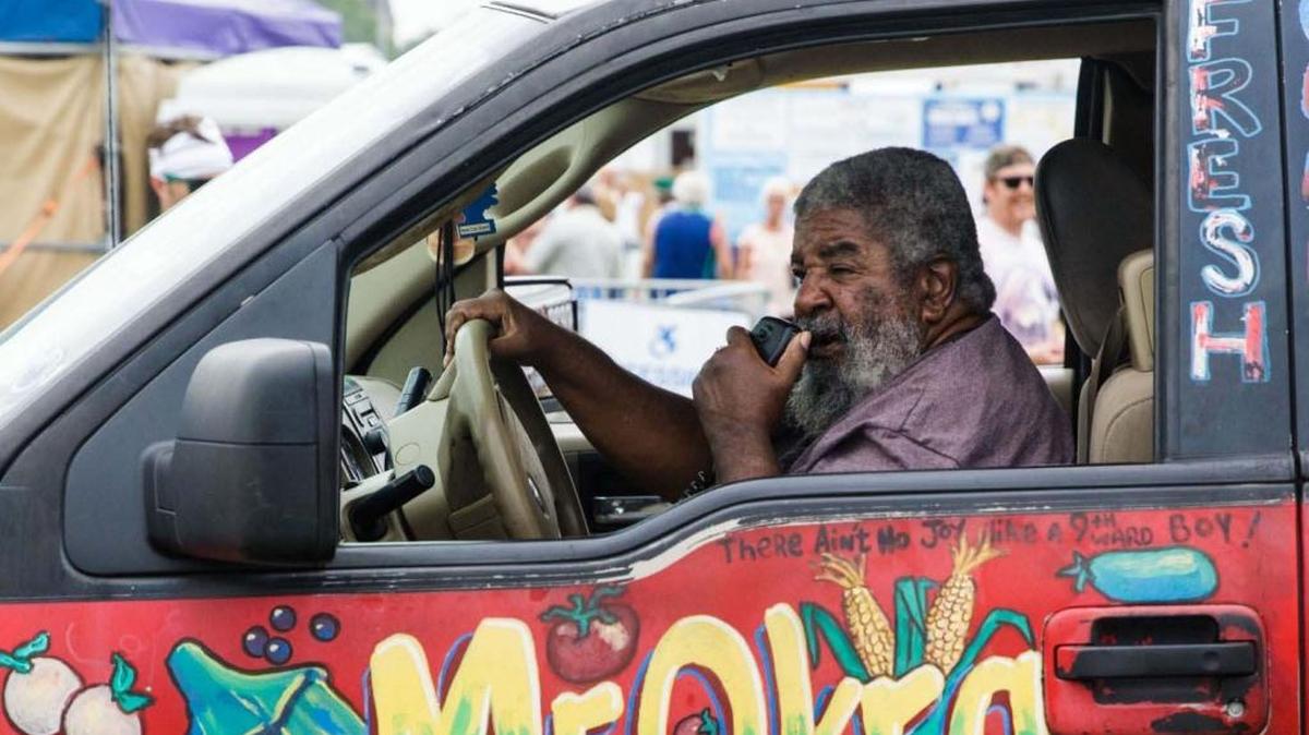 Mr. Okra sits in his stationary truck at the New Orleans Jazz and Heritage Festival 2017 at the Fair Grounds in New Orleans. Mr. Okra, aka Arthur Robinson, died Thursday, February, 15, 2018.