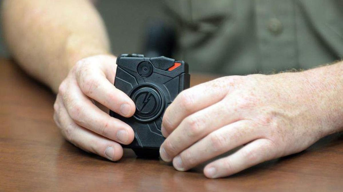 A Taser Axon Flex body camera is displayed at a press conference that were distributed to Lafayette Parish Sheriff's deputies. In January, Louisiana will equip all troopers with body cameras.