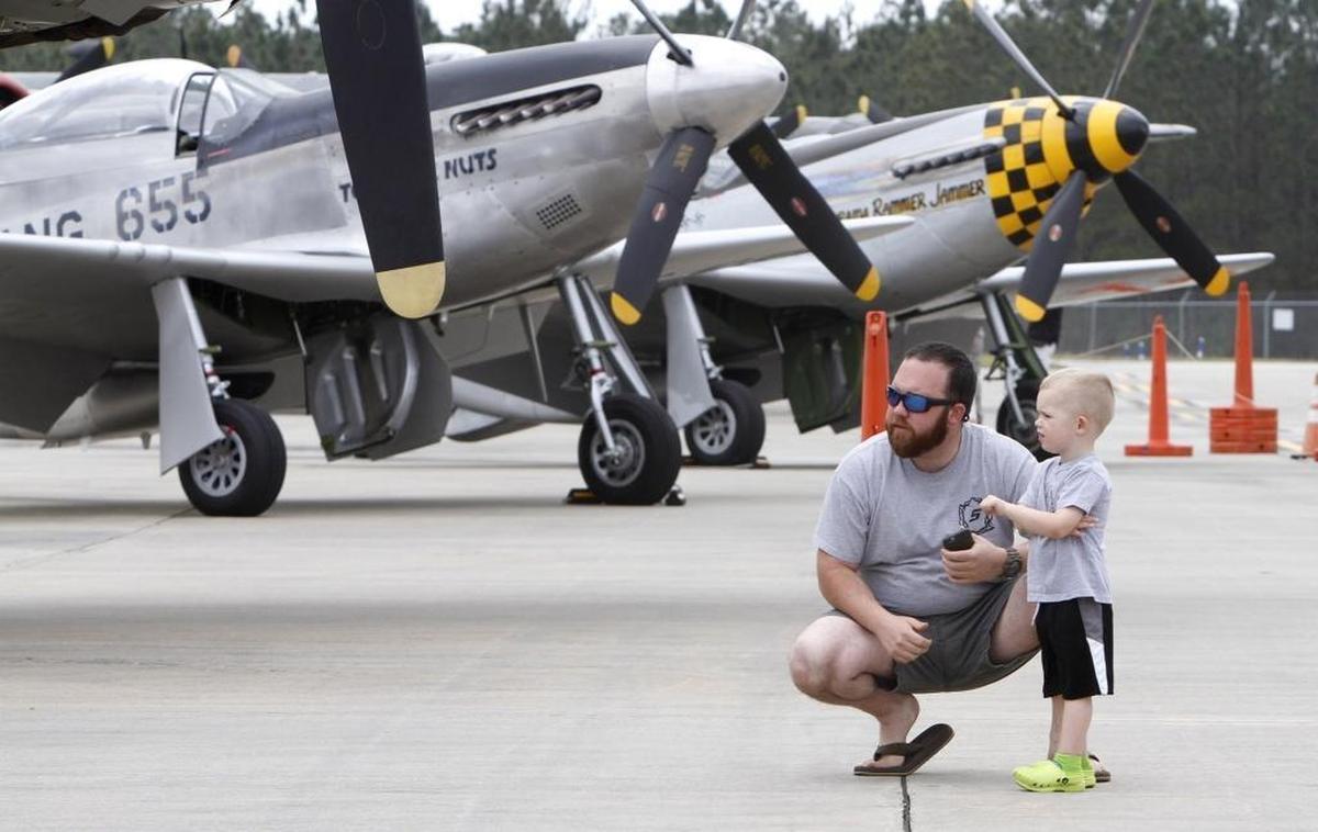 Matthew Felder takes his son, Moore Felder, to see World War II-era planes in Gulfport. The planes on display include two P51 Mustangs, a B-17 Flying Fortress, a B-24 Liberator and a B-25 Mitchell. Photographer’s comment: I thought this was a nice father, son moment that was captured. I usually like to get the image before asking for names. When people realize a camera is around, they usually aren’t as natural and spontaneous. I like to be that “fly on the wall” and capture a found moment such as this.