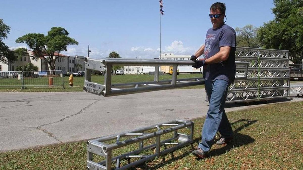 Walker Audio & Visual co-owner Casey McConnell of Ocean Springs stages pieces of a tower that will span the entrance at Centennial Plaza in Gulfport on Tuesday, March 28, 2017, for the Mississippi Bicentennial Celebration South.
