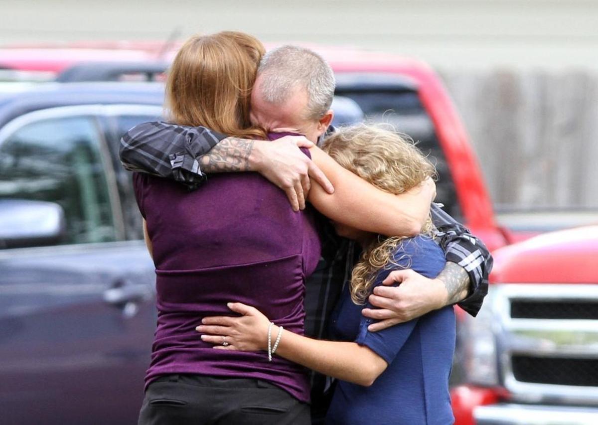 Casey Havard, father of Spencer Havard, hugs his daughter, Tamara, right, and family friend, Janet Hannessee, outside Freeman Funeral Home in Leaksville in March 2017. Spencer Havard, 16, was one of three children killed in a George County crash. The driver of the vehicle, Jesse Dickerson, pleaded not guilty to three charges of second degree murder on Monday.