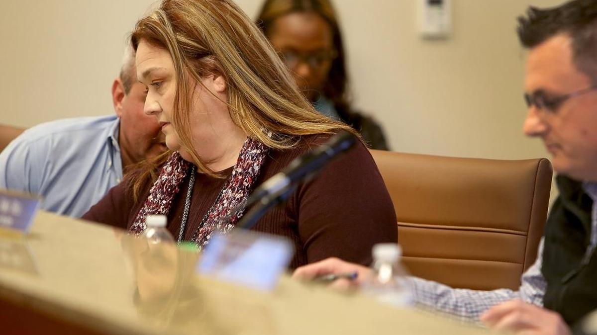 Bay-Waveland School District superintendent Vikki Landry, center, talks with board attorney Ronnie Artigues, left, during the Bay-Waveland School District's school board meeting on Monday, March 12, 2018, in Bay St. Louis. The board accepted Landry's resignation, effective June 30.