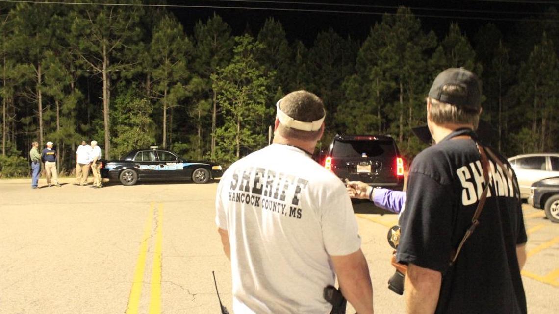 Hancock sheriff’s officials and Waveland police investigate a report of a child abduction Monday night in the woods west of the Waveland Wal-Mart.