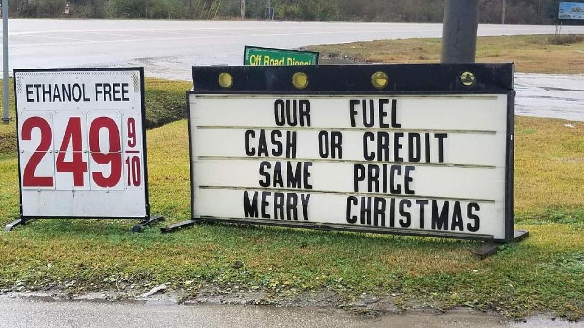 The sign outside Dolly's Quick Stop in Kiln assures customers they will pay the same price for gasoline no matter they payment method.