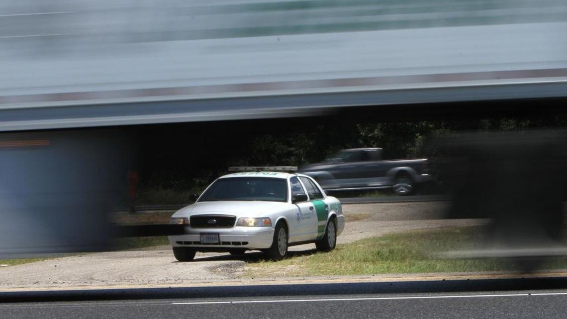 U.S. Border Patrol agents monitor traffic on I-10 in Harrison County on Wednesday.