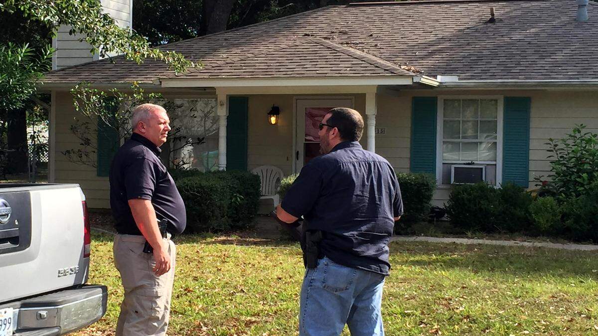 Investigators with Long Beach Police Department were back Friday at the house on Seal Avenue where a man's body was found in a container in the back yard on Thursday afternoon.