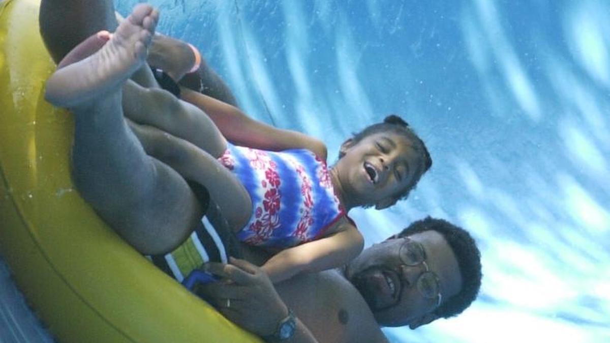 Arthur McInnis and daughter Maya, 6, of Pascagoula make their way down the tube slide in 1999 at Slippery Sams water park on U. S. 90 in Biloxi in 1999. New curves and family fun at the site could come next spring if the Biloxi Council approves the permit on Tuesday.