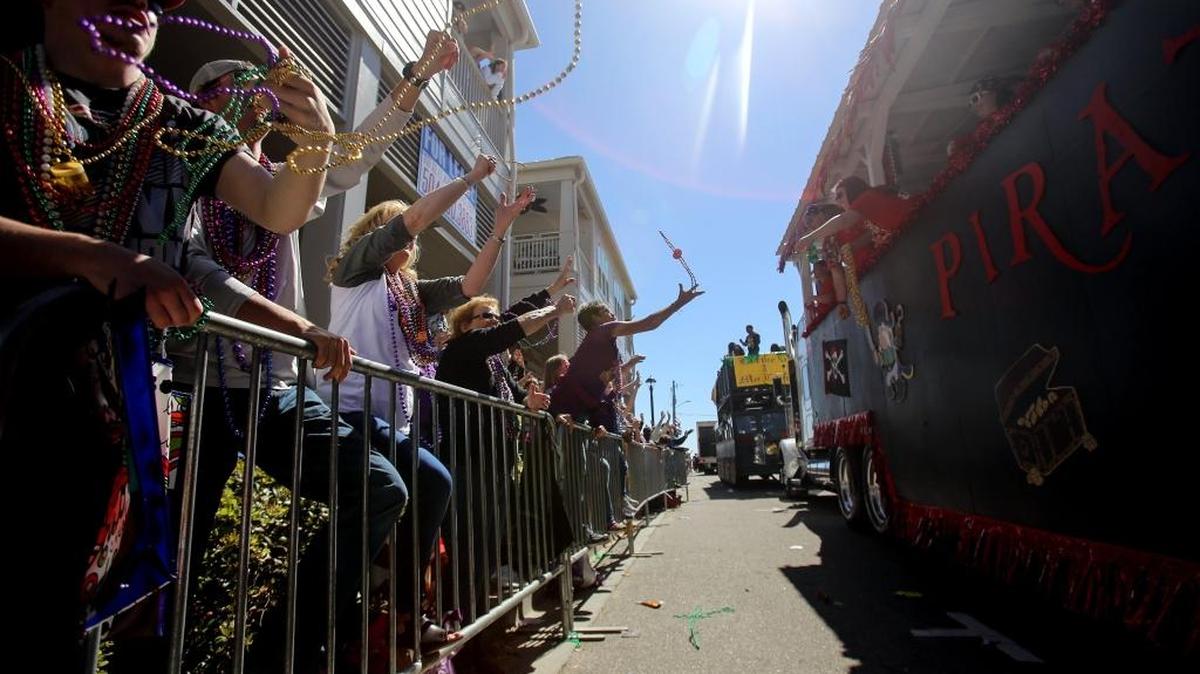 Paradegoers yell for throws as the St. Paul Carnival Association parade rolls through downtown Pass Christian on Sunday, February 26, 2017. ‘Pass Beyond Galaxies: An Outer Space Adventure’ was this year's theme.