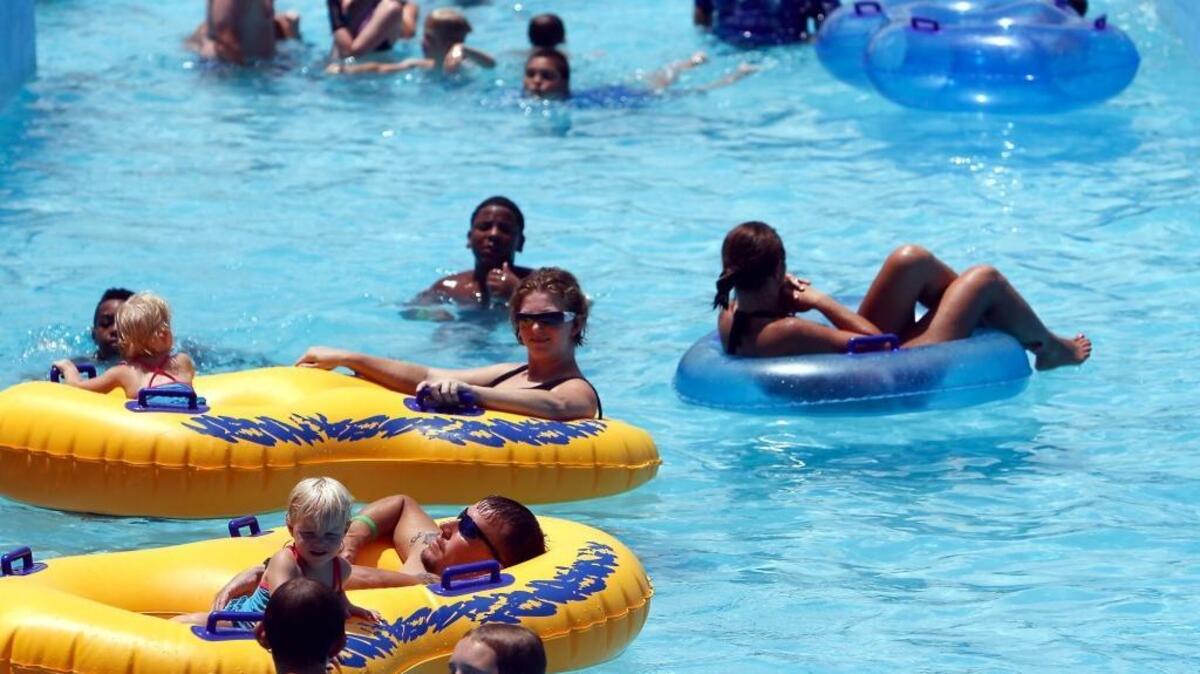 People relax and cool off while floating down the Lazy Pearl River, one of the many water attractions at Gulf Islands Water Park in Gulfport.