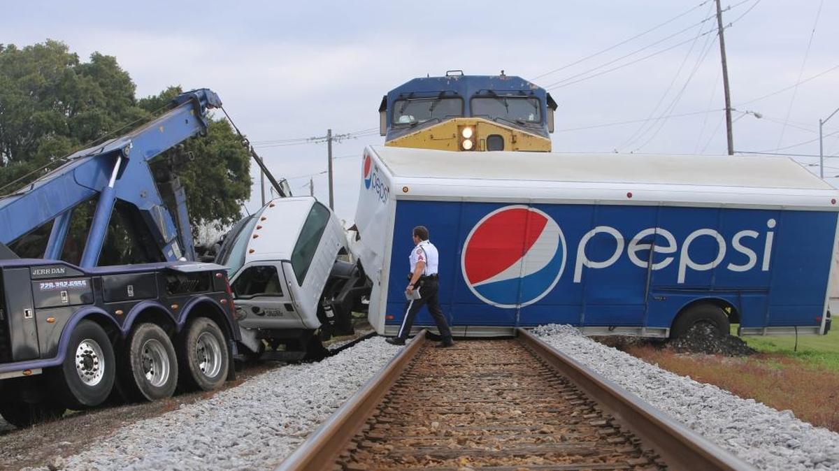 A train hit an 18-wheeler hauling Pepsi products that was stuck on the tracks near Main Street in Biloxi on Jan. 5.