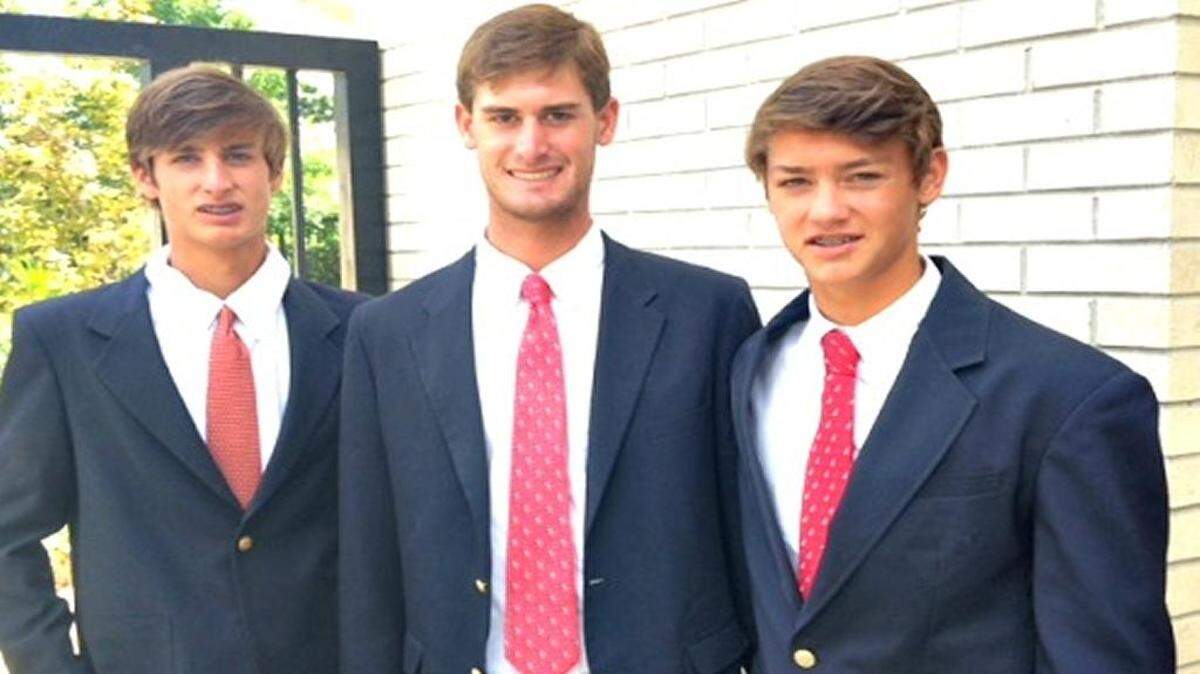 John Harrison Doucet, 20, of Gulfport, critically injured Sunday by an electric shock, got a visit Friday from his younger brothers at a Georgia burn center. In this photo taken in July, John Harrison is flanked by Dawson, 17, left, and Louis, 15, at Trinity United Methodist Church.
