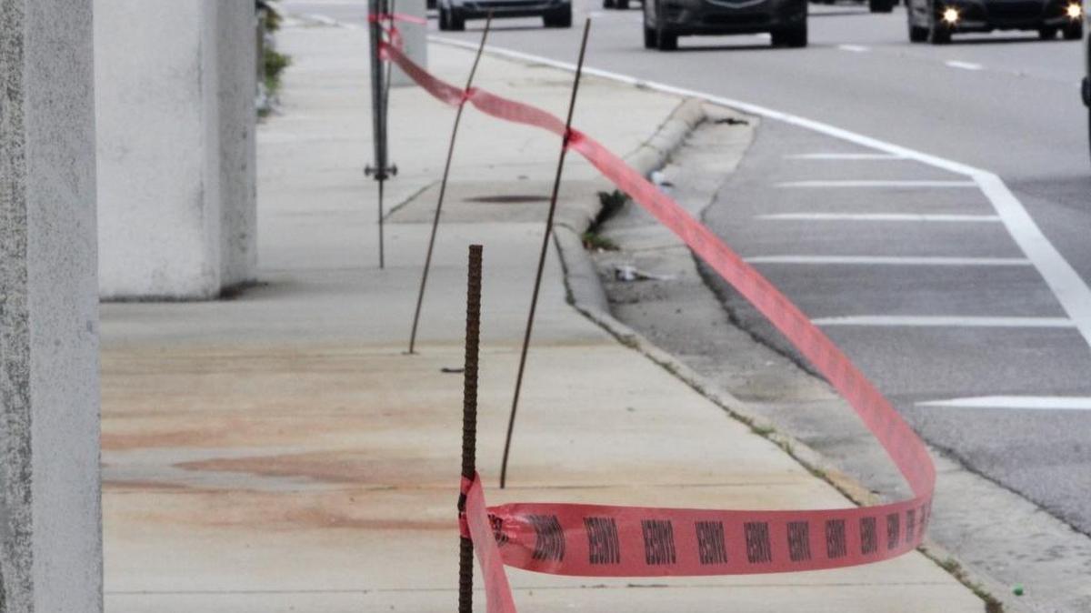 Rebar is used to hold caution tape along U.S. 90 under I-110 in Biloxi to prevent motorists from parking on the sidewalk during Mardi Gras parades.