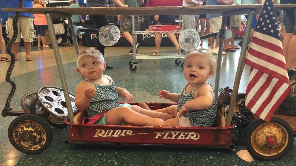 The Thompson twins, Raelynn and Realee of Pensacola, make their debut at Scrapin the Coast in Saturday, June 24, 2017, in their own “low rider.”