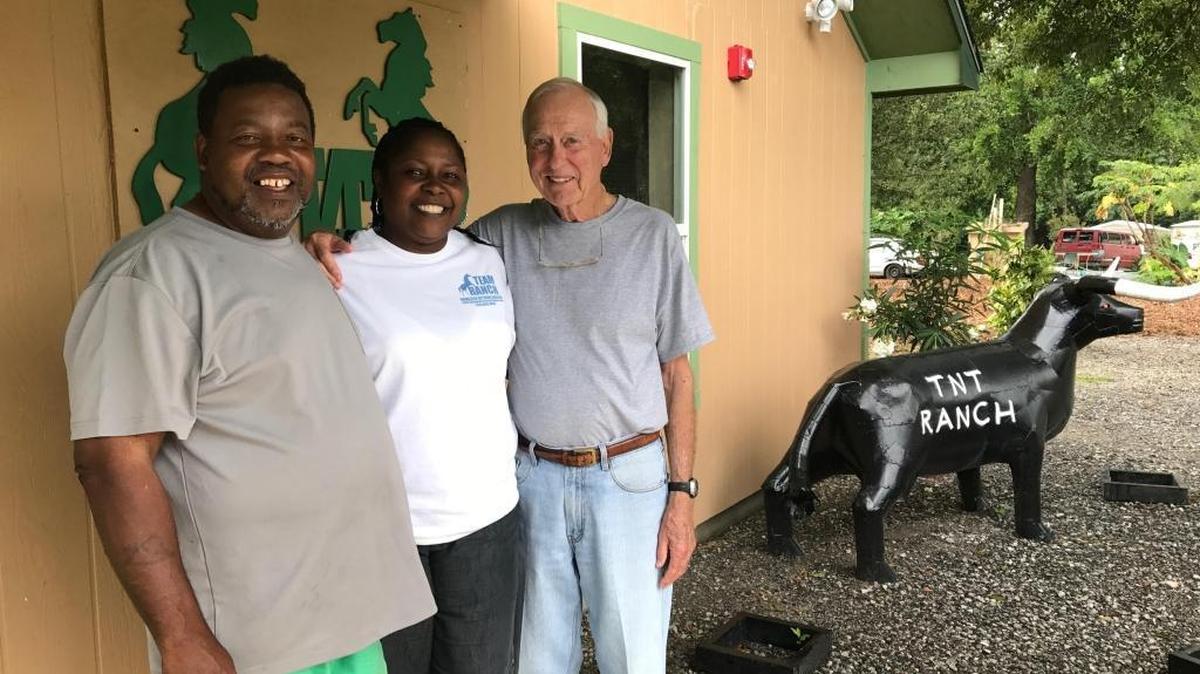 Tony Stapleton, left, and wife Shirlene visit with Ted Hearn, a retired Gulfport executive who has supported their efforts to open a new dorm at their TNT Ranch Recovery Home north of Gulfport in Harrison County.