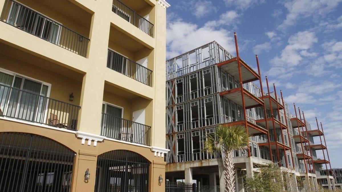 Residents of the Inn by the Sea condominiums, left, have been neighbors to the unfinished Village at Henderson Point project for years. Harrison County ordered the Village structures be demolished in 2016, and the owner is fighting that order in court.