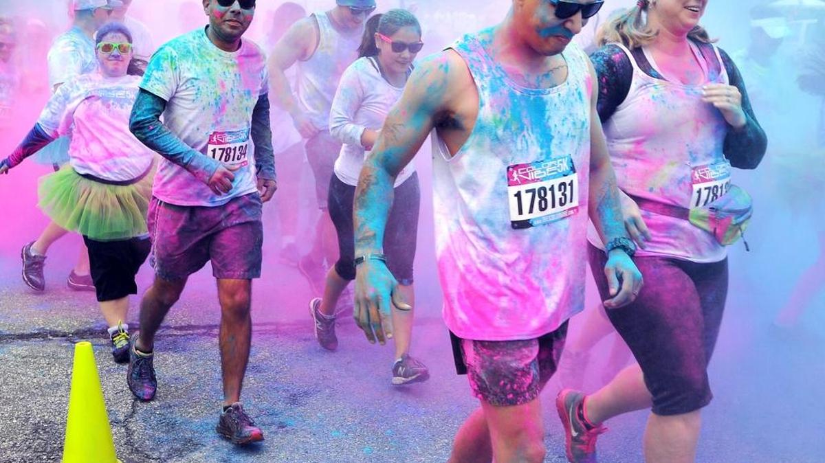 Runners kick off the start of the 2014 Color Vibe 5K run in Columbus, Georgia.