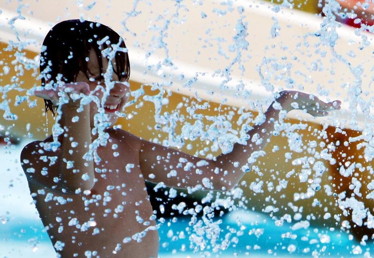 A spray of water cools kids at Gulf Islands Water Park in Gulfport, which is open daily for the summer season.