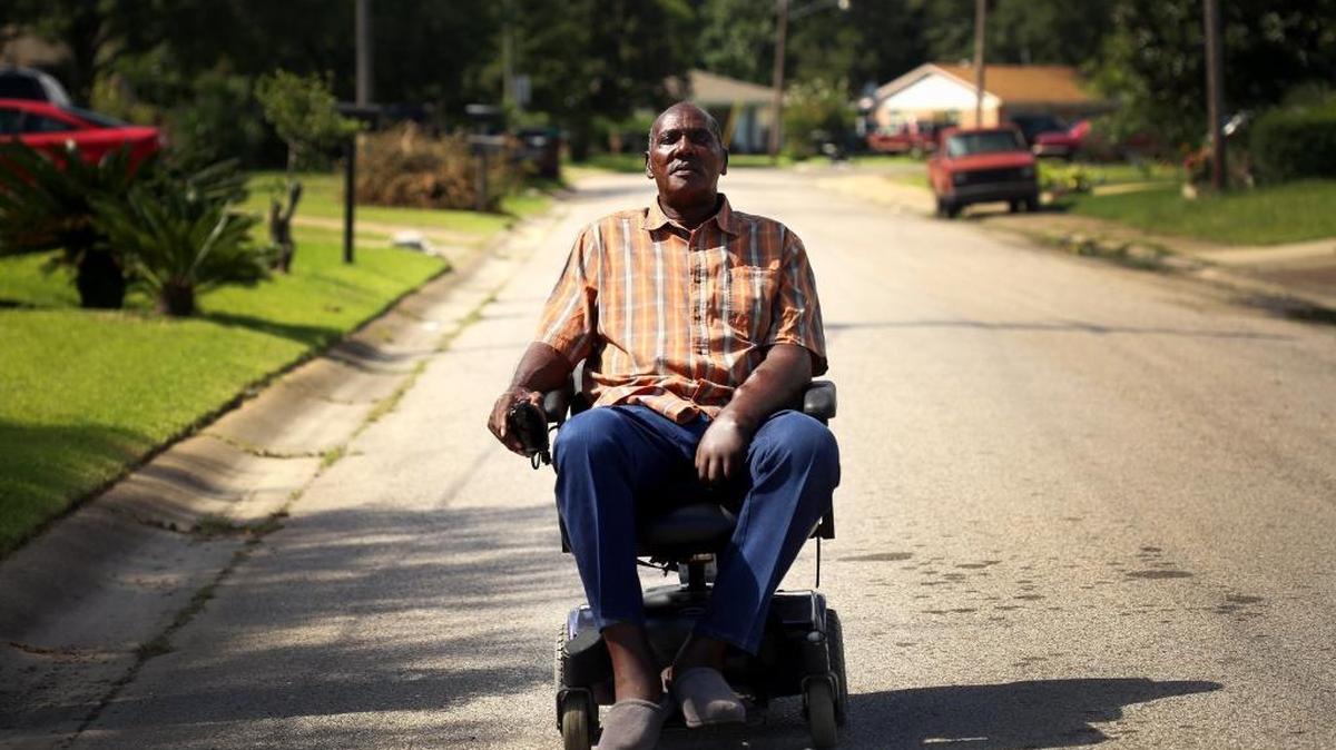 Jimmy Dyess uses his power chair to get around to talk to his neighbors and tell people his stories about taking themselves before it is too late.