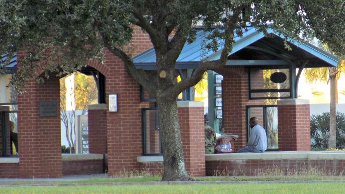 Homeless people gather at a bus stop on U.S. 90 in downtown Biloxi. After receiving numerous complaints from residents and business owners in the downtown, the City Council in 2017 passed an ordinance requiring licenses to panhandling. On Tuesday they discontinued licenses but set regulations and distance requirements for panhandling.