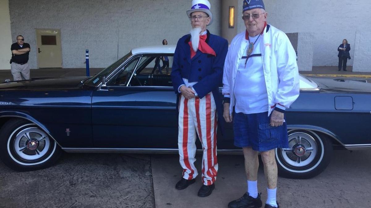 Veterans Dave Fournel, U.S. Marines, and Al Fellows, U.S. Navy, make preparations to ride in Fellows’ 1965 Galaxy Ltd. in the Gulf Coast Veterans Day Parade on Saturday, Nov. 11, 2017.