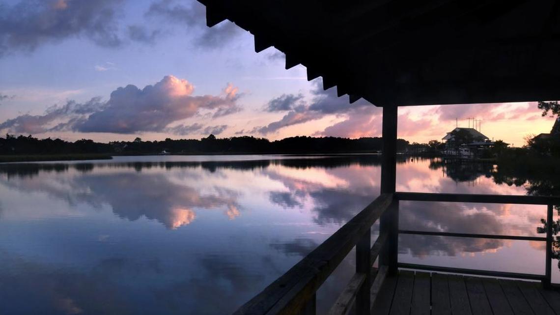 Morning clouds are reflected in Bernard Bayou in 2017 as the sun rises in Gulfport. Bernard Bayou empties from the west into Big Lake and Gulfport Lake, joining the waterways of the Industrial Seaway canal.