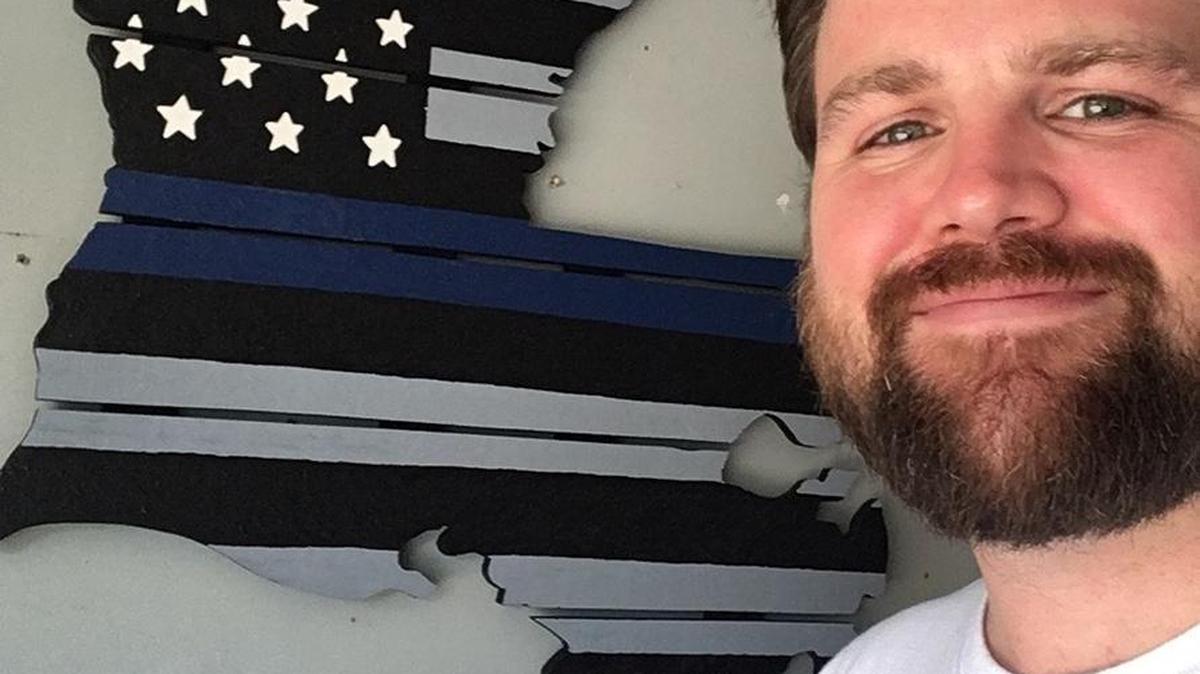 Adam Nash shows off his finished wall sculpture that he plans to bring to the Baton Rouge Police Department on Aug. 1.
