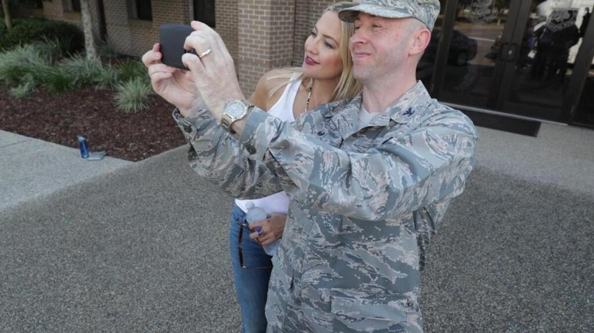 Kate Hudson poses with an airman on Tuesday, Sept. 20, 2016 during a visit to Keesler Air Force Base in Biloxi.