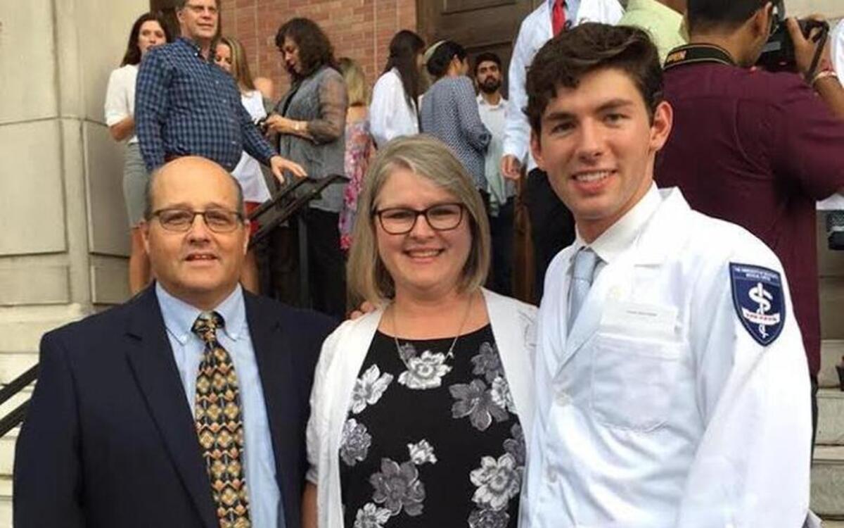 Andrew Strachan was joined at his white coat ceremony, marking his entry into medical school, by foster parents Roddy and Lucy Russell of Gulfport, whom he now calls mom and dad. Strachan met the Russells at First Presbyterian Church in Gulfport shortly before being placed in the Harrison County Emergency Children's Shelter. They became certified as foster parents so that Andrew could live with them and pursue his dream of attending medical school.