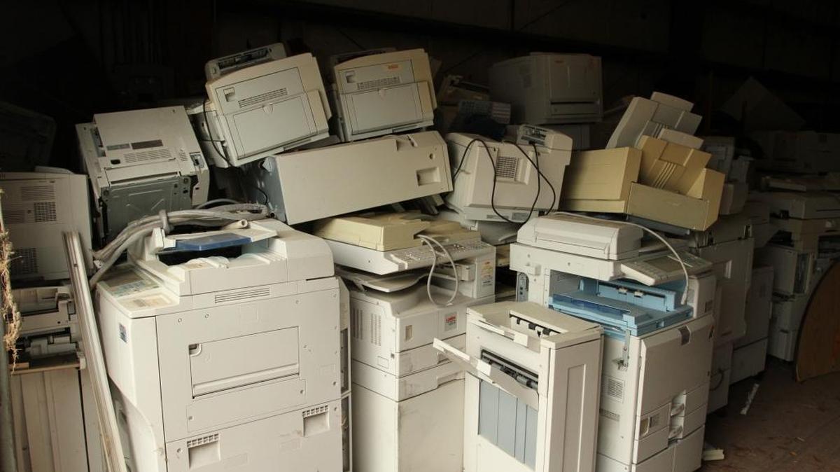Harrison County copiers, printers and faxes are stacked in a warehouse at 526 Railroad Street in Gulfport, where they will be sold at auction at 11 a.m. Thursday because a vendor never came to pick them up.
