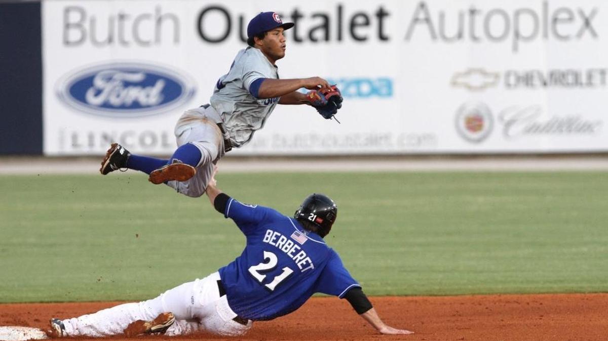 Chattanooga shortstop Heiker Menesses dives over Biloxi's Parker Berberet during a double play to end the third inning of their Southern League game at MGM Park in Biloxi on Thursday July 16, 2015.