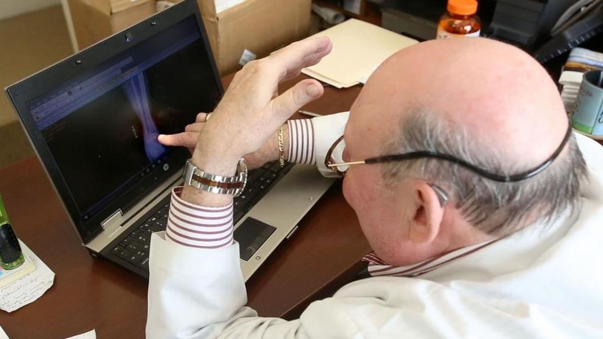 Dr. Robert Weierman looks over X-rays at Bethel Free Health Clinic on Wednesday, Feb. 1, 2017.